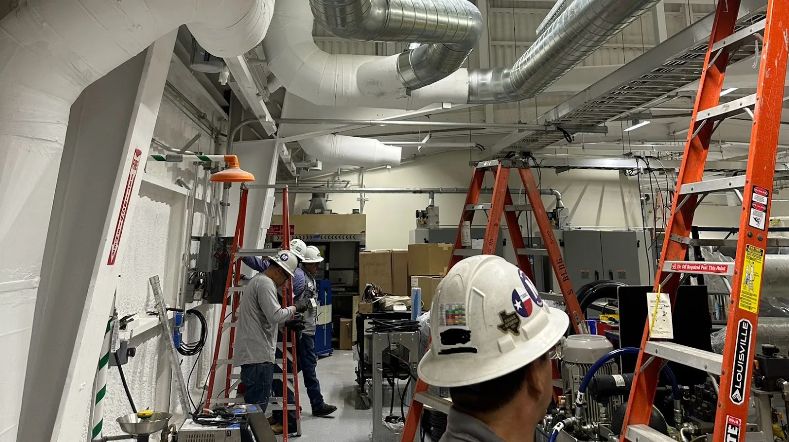 Prestige Air Service technician on a commercial HVAC job serving Willis, TX